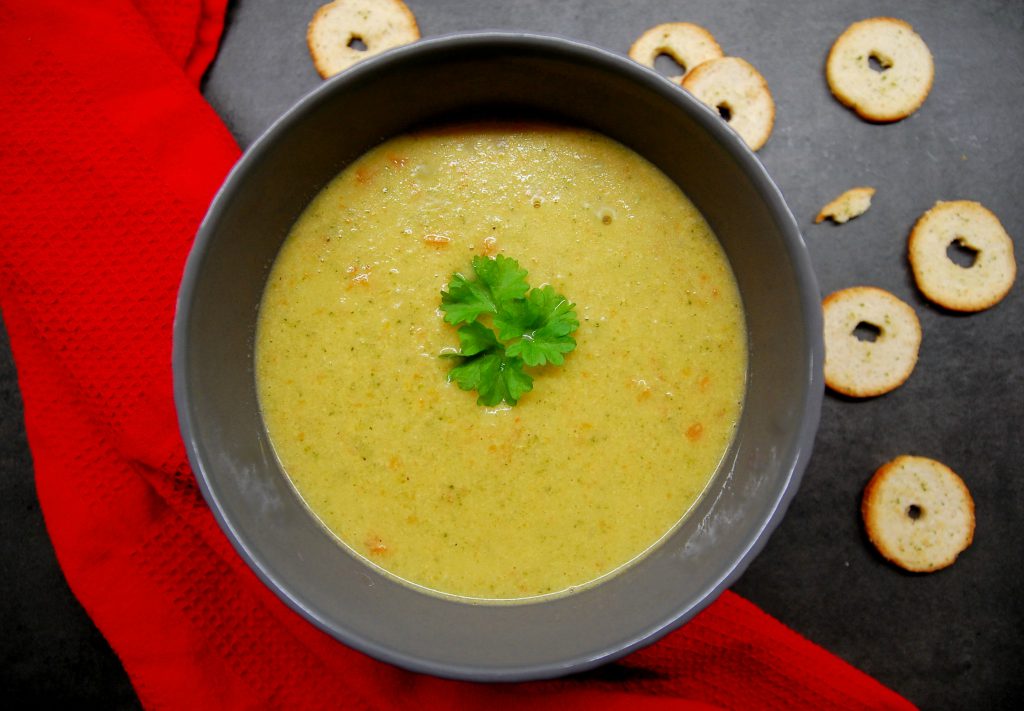 bowl of broccoli cheddar soup with bread chips